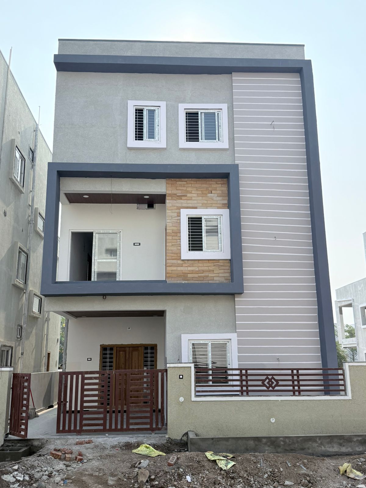 Close front elevation of grey Indus Homes villa